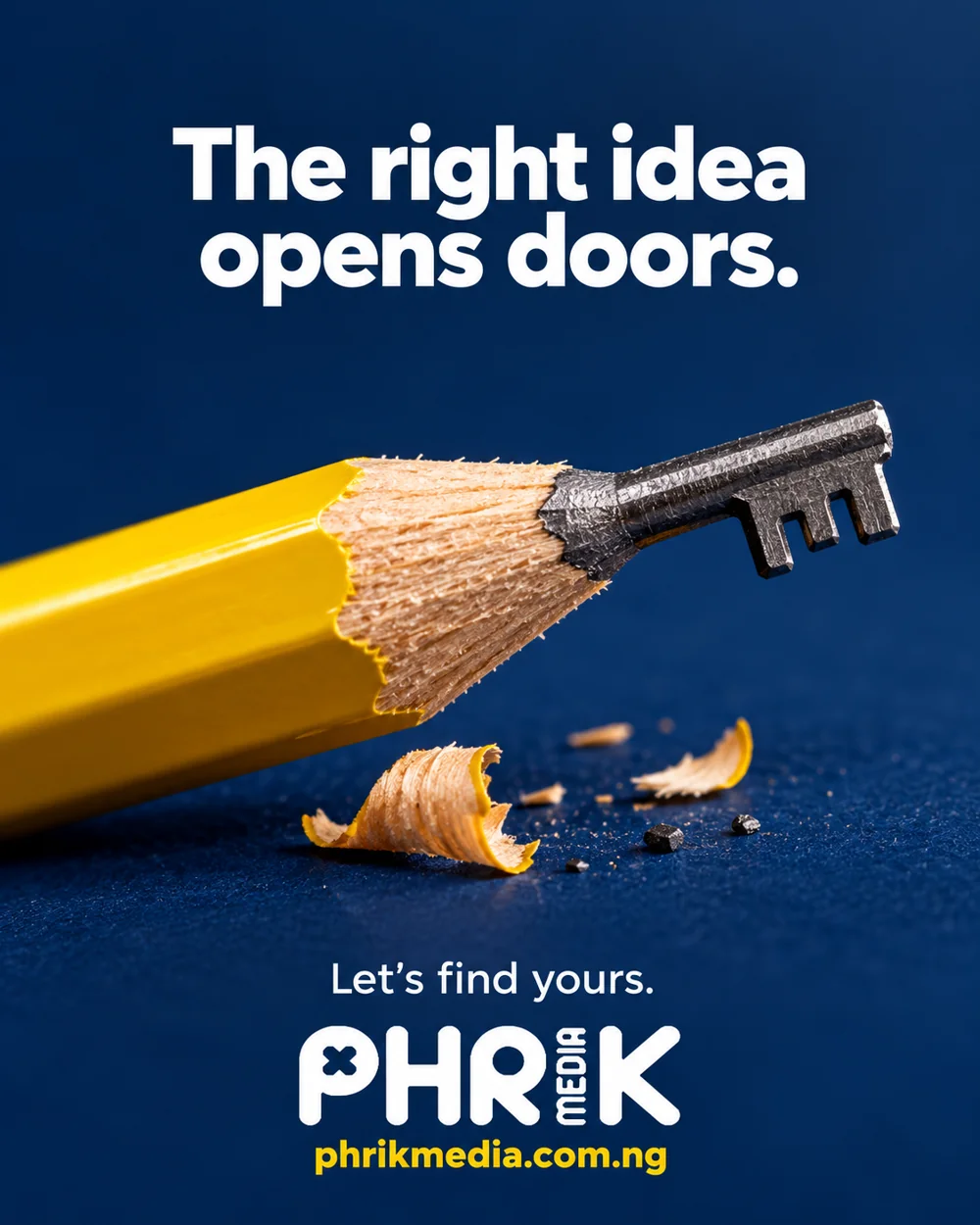A yellow pencil with its graphite carved into a key, on a blue background.